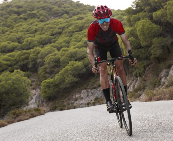 male-cyclist-training-with-bicycle-outdoors